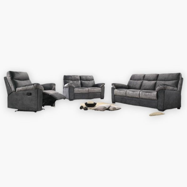 A set of Abeka recliner sofas in dark grey and light grey colors, including a one-seater recliner, a two-seater sofa, and a three-seater sofa, arranged in a living room setting with a cat lying in front of the three-seater sofa.
