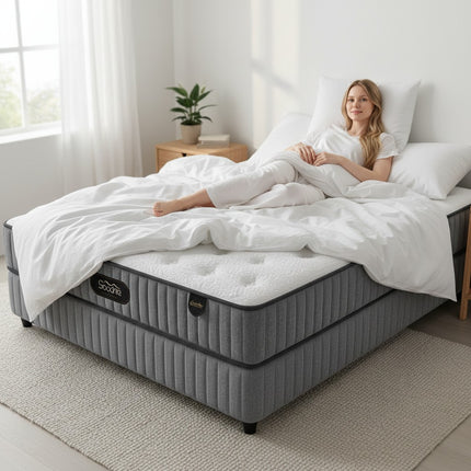 Woman resting on a F31 Furniture premium multi-layer pocketed spring mattress with cooling ice silk fabric.
